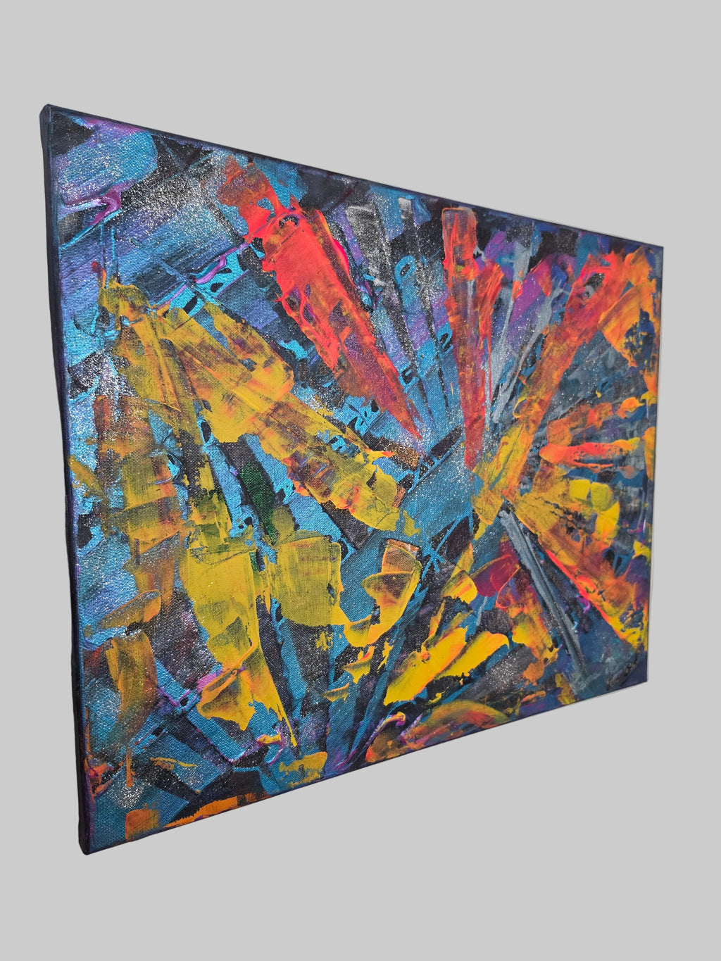 Vue latérale du tableau abstrait lumineux Explosion Chromatique™ mettant en valeur l'épaisseur de la toile et le travail de la matière.
