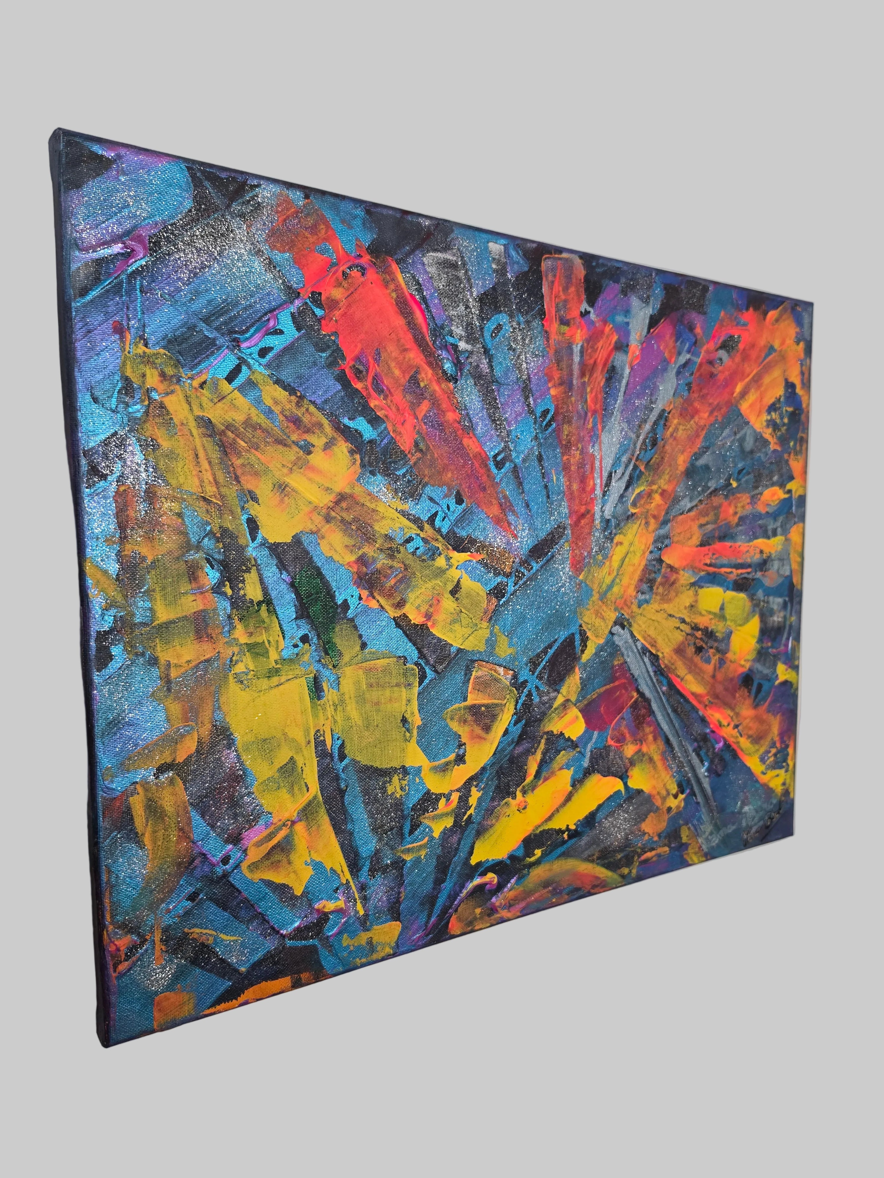 Vue latérale du tableau abstrait lumineux Explosion Chromatique™ mettant en valeur l'épaisseur de la toile et le travail de la matière.