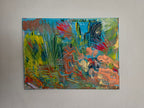 Œuvre originale Lagon Imaginaire™ accrochée sur un mur clair mettant en valeur les couleurs lumineuses et les détails abstraits